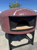Hand-cut logo inlaid in the mosaic tiles of a Verona-560 pizza oven